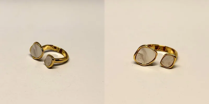 Anel dourado aberto com duas pedras claras nas pontas — ref. ANL0137A