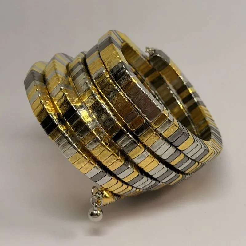 Bracelete de várias voltas em malha articulada, alternando dourado e prateado — ref. BTE0102A