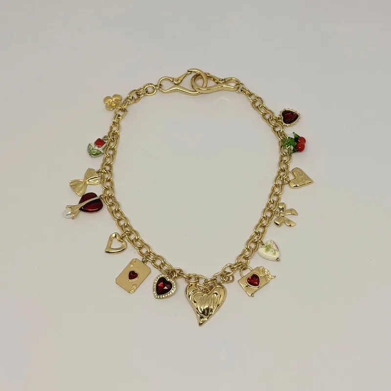 Colar dourado com pingentes de charm e elos variados — ref. CLR0030A
